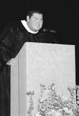 Greg Jones speaking at podium